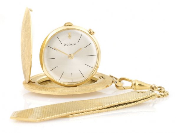 An 18 Karat Yellow Gold Pocket Watch, Corum, 44.30 dwts: An 18 Karat Yellow Gold Pocket Watch, Corum, with a gold silverized dial, black baton numerals, gold hands, stem wind, stem set, Swiss made. The outer case has a chevron finish and the inside case sta
