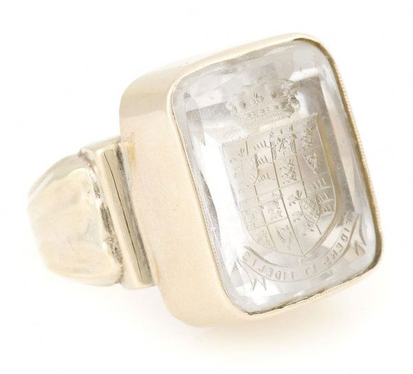 A 14 Karat Yellow Gold and Rock Crystal Intaglio Ring, : A 14 Karat Yellow Gold and Rock Crystal Intaglio Ring, containing a rectangular rock crystal intaglio of a shield. 10.00 dwts. Size 10.