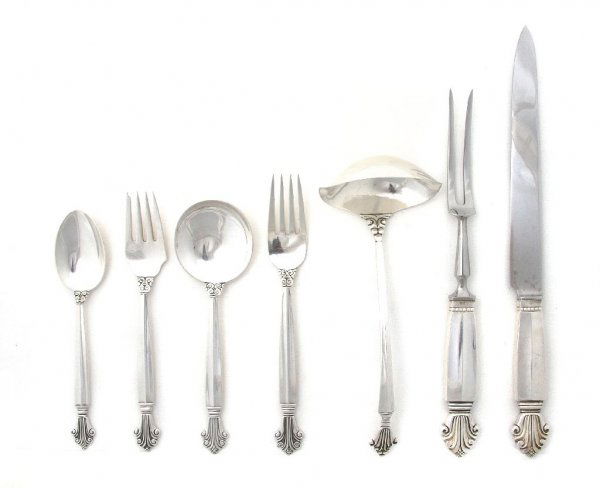 A Partial Set of Danish Sterling Silver Flatware, Georg: A Partial Set of Danish Sterling Silver Flatware, Georg Jensen, in the Dronning (Acanthus) pattern designed by Johan Rohde, comprising 11 dinner knives, 11 dinner forks, 11 teaspoons, 11 salad forks,