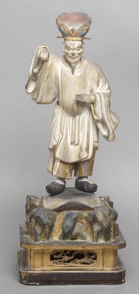 A Japanese Edo Period Wood Guardian Figure, Height over: A Japanese Edo Period Wood Guardian Figure, the carved, gilt and polychrome decorated figure depicted with furrowed brow in flowing white robes with one arm raised, the figure raised atop a carved woo