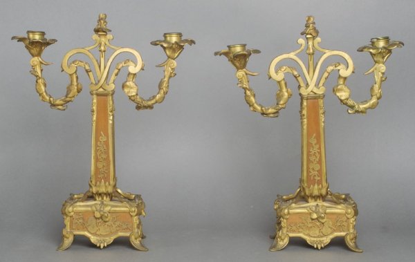 A Pair of French Gilt Bronze Mounted Art Nouveau Candel: A Pair of French Gilt Bronze Mounted Art Nouveau Candelabra, each of two-light form having scrolling candle arms issuing from a tapering square standard raised on a rectangular base, with foliate deco