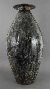 A French Ceramic Vase, Fernand Rumebe (1875-1952), Heig: A French Ceramic Vase, Fernand Rumebe (1875-1952), of elongated ovoid form with inverted lip and open bottom, having an allover drip glaze, signed F. Rumebe, numbered 52.k5. Height 30 inches.