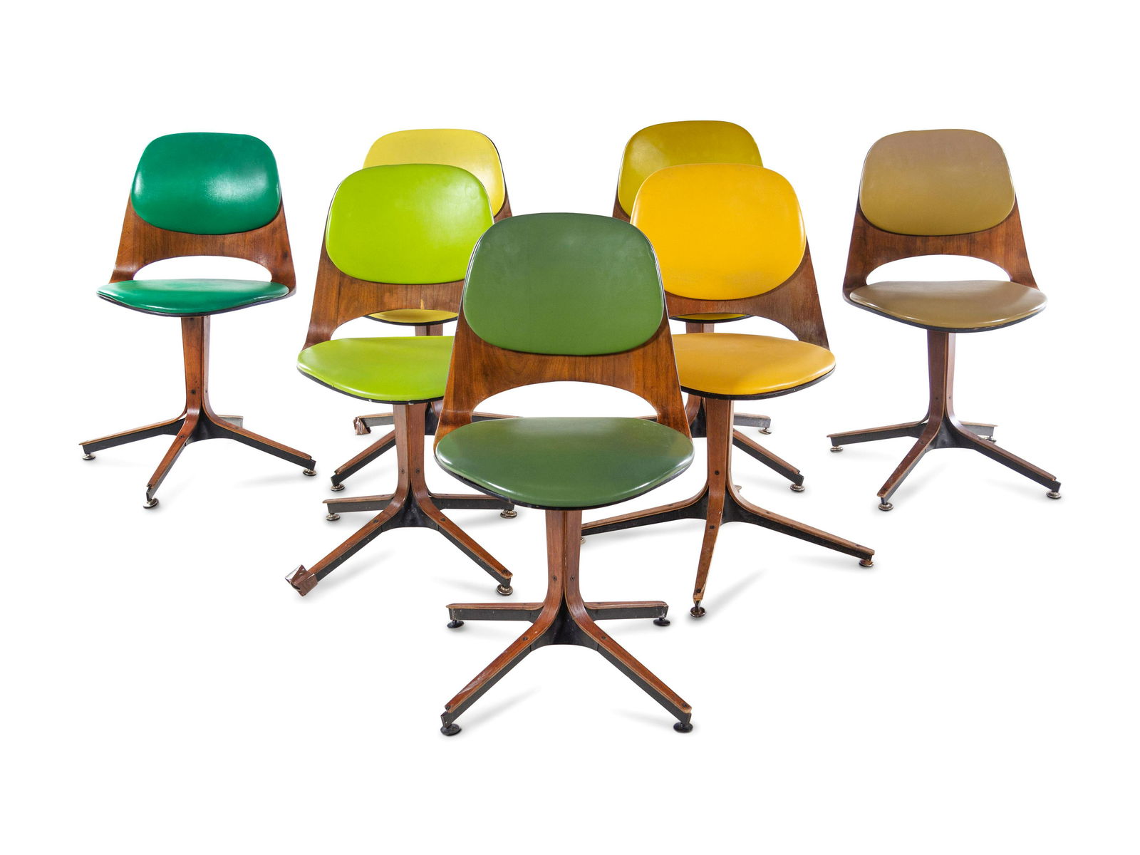 George Mulhauser (American, 1922-2002) Dining Table: George Mulhauser (American, 1922-2002) Dining Table and Set of Seven Dining Chairs,Plycraft, USA vinyl, wood manufacturer's decal label to underside of select examples Table | H 29 x Diameter 52 inche