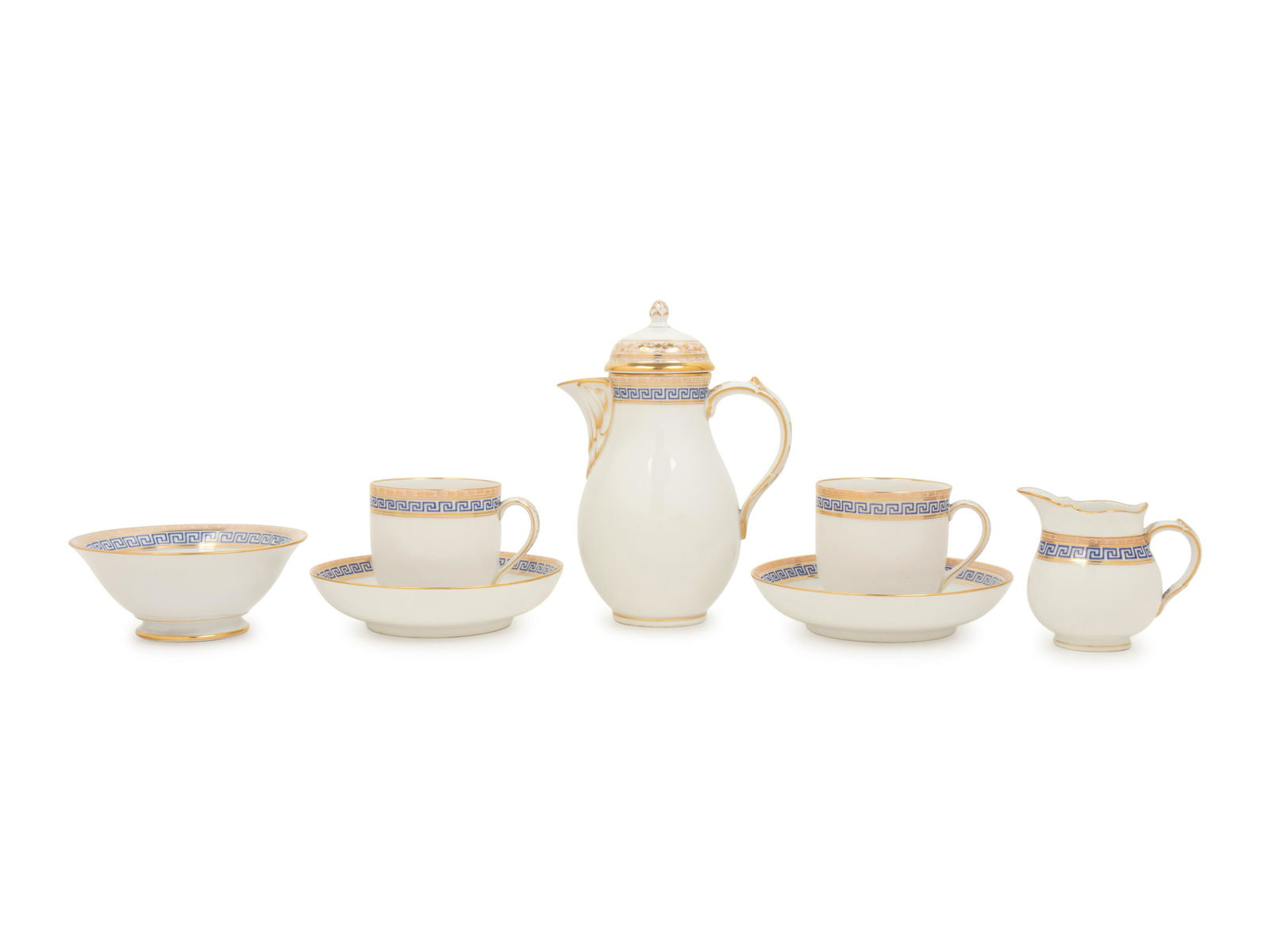 A KPM Porcelain Tete-a-Tete: A KPM Porcelain Tete-a-Tete 20th Century comprising a pair of teacups and saucers, teapot, creamer and sugar bowl. Height of teapot 7 inches. Sold to Benefit the Acquisition Fund of the Indianapolis M