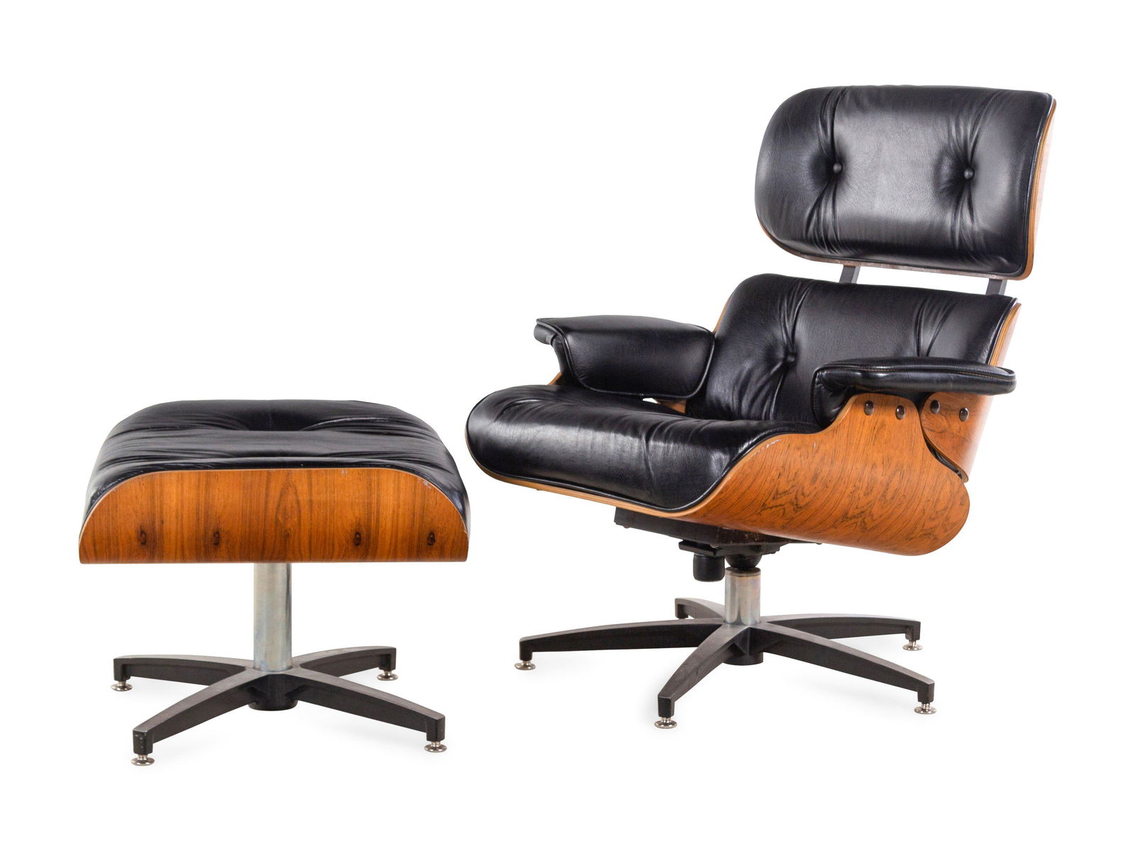 A Faux Leather and Rosewood Lounge Chair and Ottoman in (1 of 2)