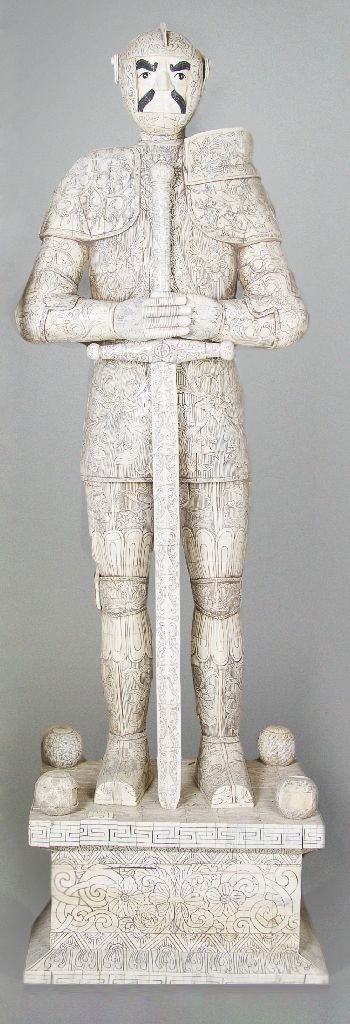 An Asian Bone Veneered Figure of a Warrior, Height: An Asian Bone Veneered Figure of a Warrior, the standing figure depicted in full armor holding a broad sword at front, the whole having carved foliate decoration throughout, raised on a rectangular pe
