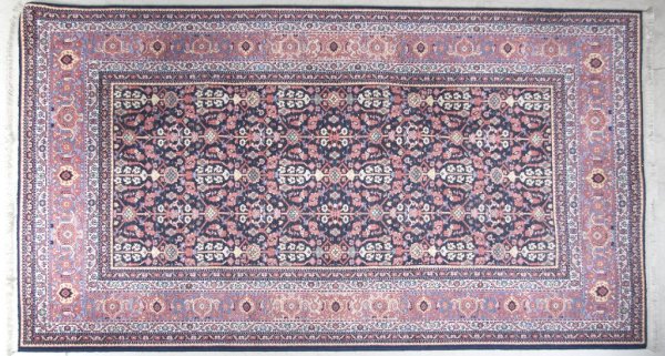 A Williamsburg Rug, by Karasta, 5 feet 8 inches x : A Williamsburg Rug, by Karasta, in the Carters Grove Pattern, machine made. 5 feet 8 inches x 8 feet 11 inches.