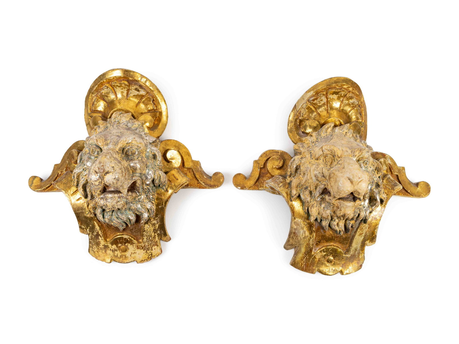 A Pair of English Part Silvered Giltwood Lion Masks: A Pair of English Part Silvered Giltwood Lion Masks SECOND QUARTER 19TH CENTURY Height 17 x width 18 3/4 inches. Provenance: Clinton Howell Antiques & Fine Art, New York, New York Collection of Mrs. A