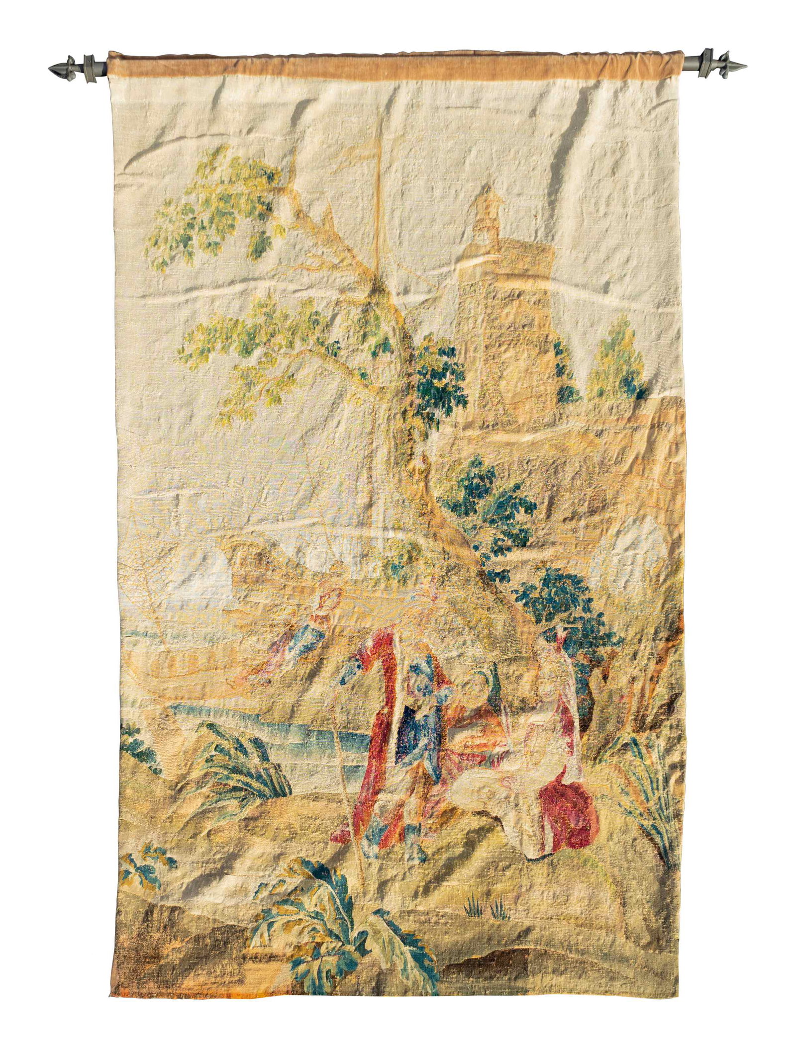 An Aubusson Tapestry Depicting Figures on Shore, Near a: An Aubusson Tapestry Depicting Figures on Shore, Near a Sailing Ship 17TH/18TH CENTURY hung from a velvet wrapped steel pole. Tapestry, height 95 x 59 inches; steel pole, length 73 1/2 inches.