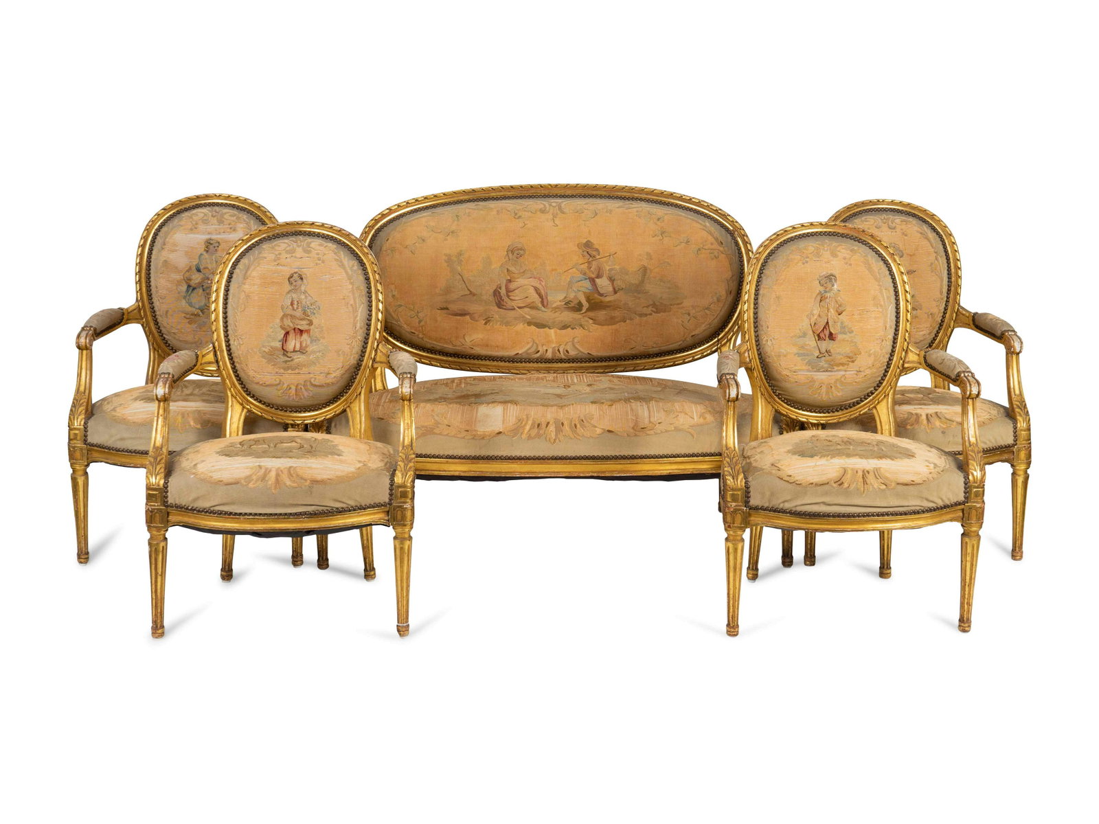 A Louis XVI Style Aubusson Tapestry-Upholstered: A Louis XVI Style Aubusson Tapestry-Upholstered Giltwood Five-Piece Salon Suite LATE 19TH/EARLY 20TH CENTURY Comprising a settee and four fauteuils Height of settee 36 1/2 x length 50 x depth 26 1/2 i