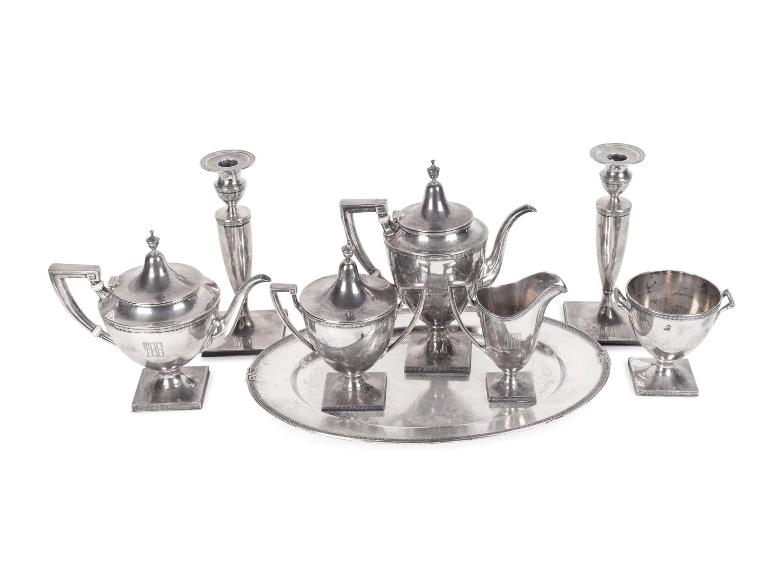 An American Silver Tea and Coffee Service with Oval: An American Silver Tea and Coffee Service with Oval Tray and Pair of Weighted Candlesticks GORHAM MANUFACTURING COMPANY, PROVIDENCE, RHODE ISLAND Etruscan pattern; comprising a coffee pot, teapot, cov