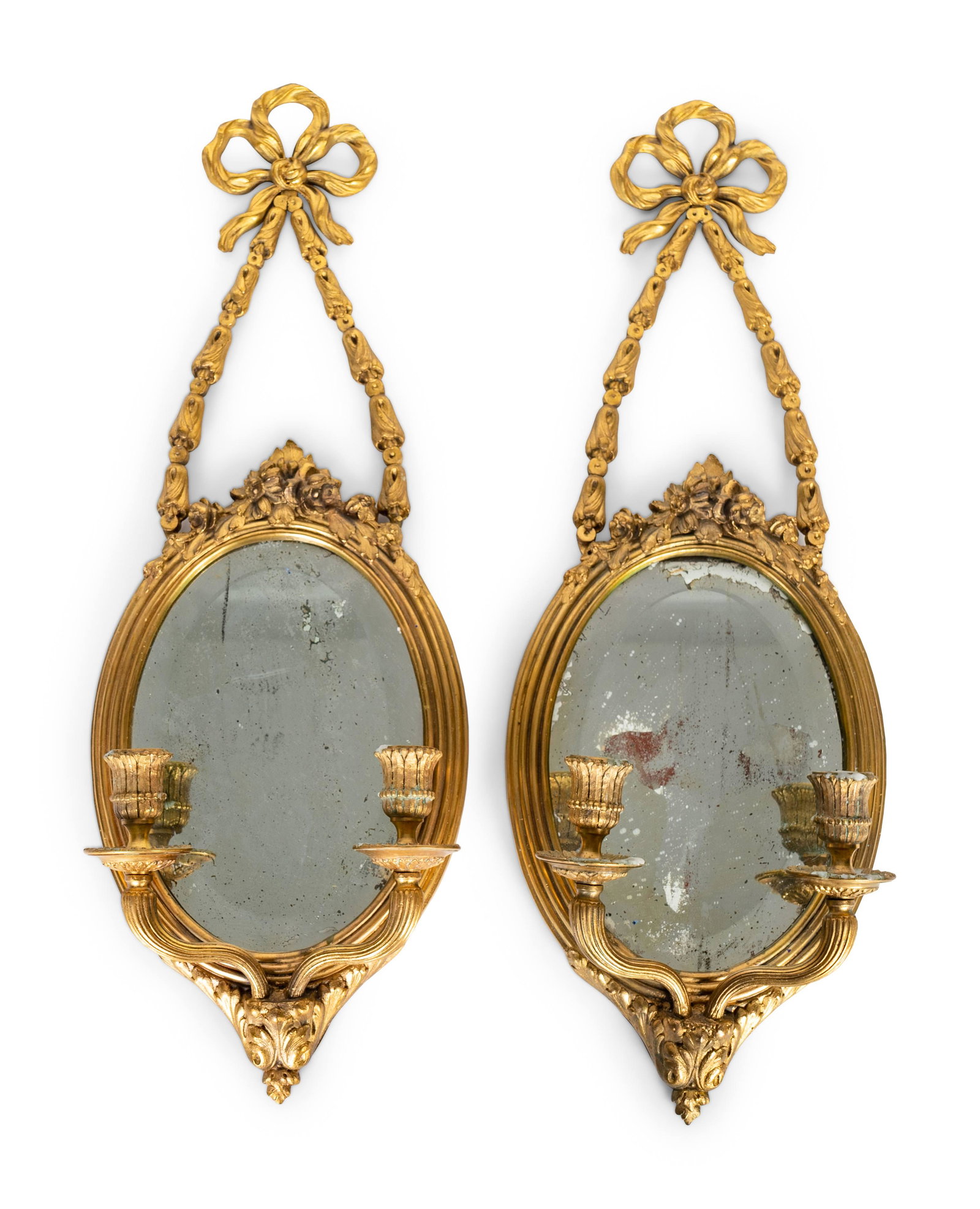 A Pair of Louis XVI Style Gilt-Metal and Beveled Glass: A Pair of Louis XVI Style Gilt-Metal and Beveled Glass Two Light Sconces 20TH CENTURY Height 24 1/2 inches. Property from a Palm Beach Collection