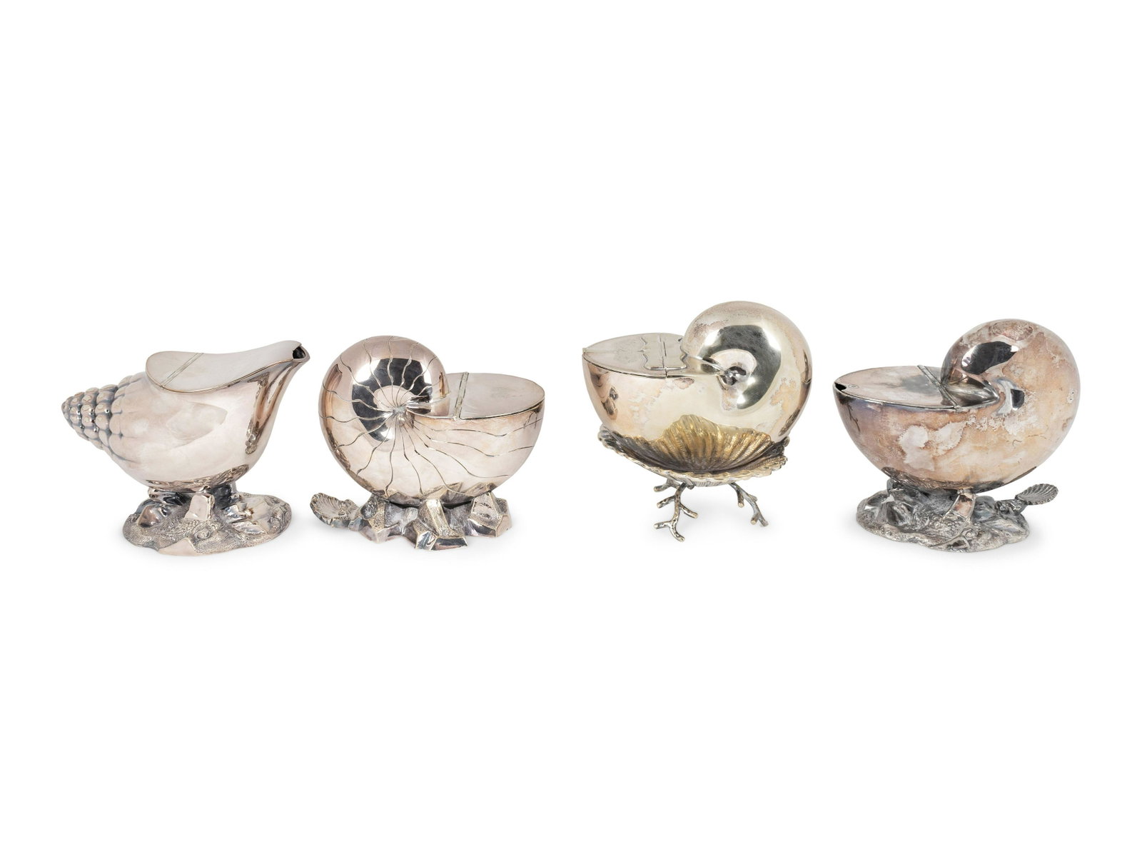 A Group of Four English Silver Plate Spoon Warmers: A Group of Four English Silver Plate Spoon Warmers 19TH CENTURY comprising two nautilus form with shell thumb pieces, one nesting in a shell-form dish raised on coral form legs, together with a conch 
