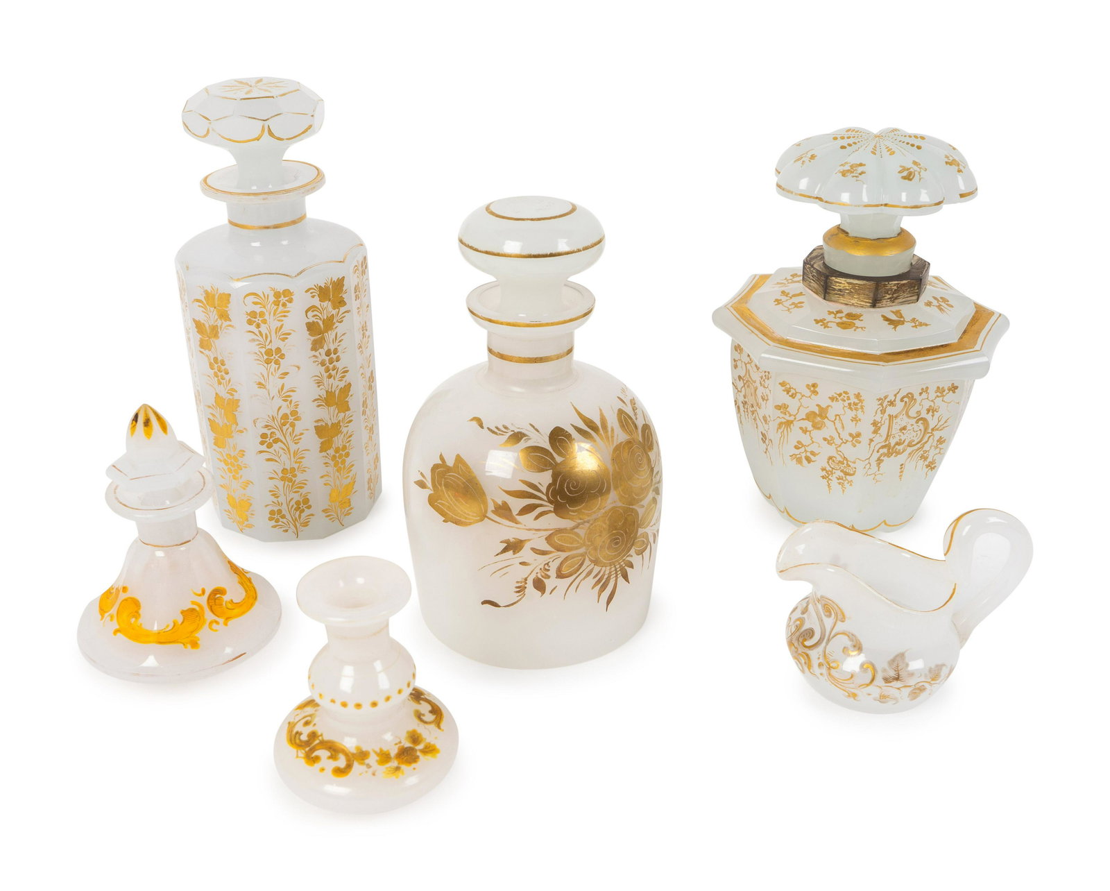 A Group of Six Parcel Gilt Opaline Glass Articles: A Group of Six Parcel Gilt Opaline Glass Articles LATE 19TH/EARLY 20TH CENTURY comprising an octagonal scent bottle, two scent bottles with stoppers, two scent bottles lacking stoppers, and a sm