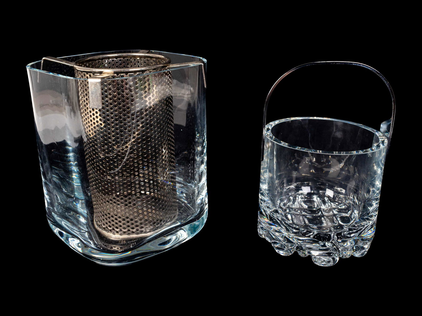An Orrefors Glass Champagne Bucket and an Orrefors Ice: An Orrefors Glass Champagne Bucket and an Orrefors Ice Bucket The champagne bucket with silvered metal bottle sleeve, the Ishink ice bucket designed by Olle Alberius, both apparently unsigned. Height