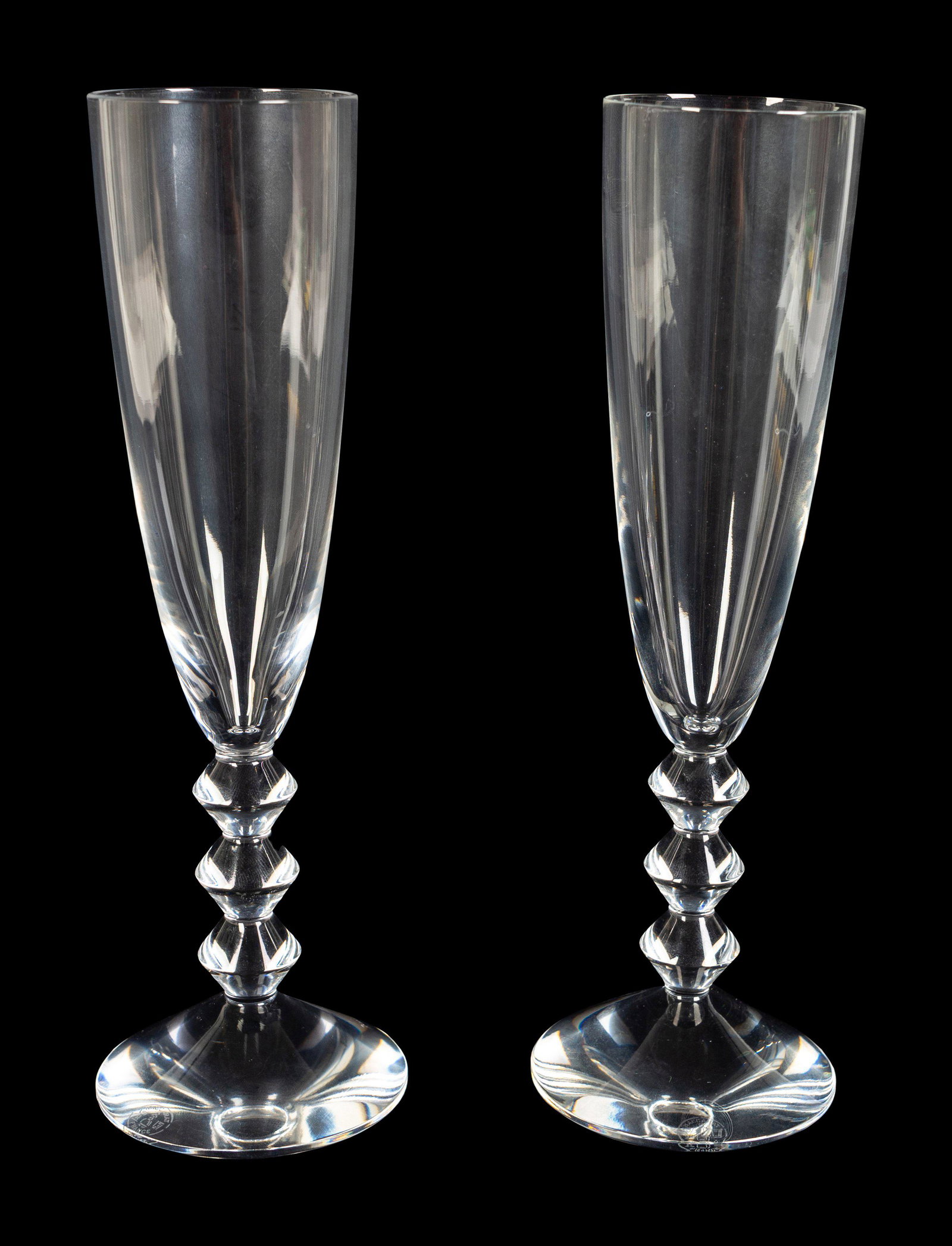 A Set of Eight Baccarat Champagnes Height 8 7/8 x: A Set of Eight Baccarat Champagnes Each base with acid-stamped mark and engraved Baccarat. Height 8 7/8 x diameter 2 3/8 inches. Property of a Boca Raton Private Collector