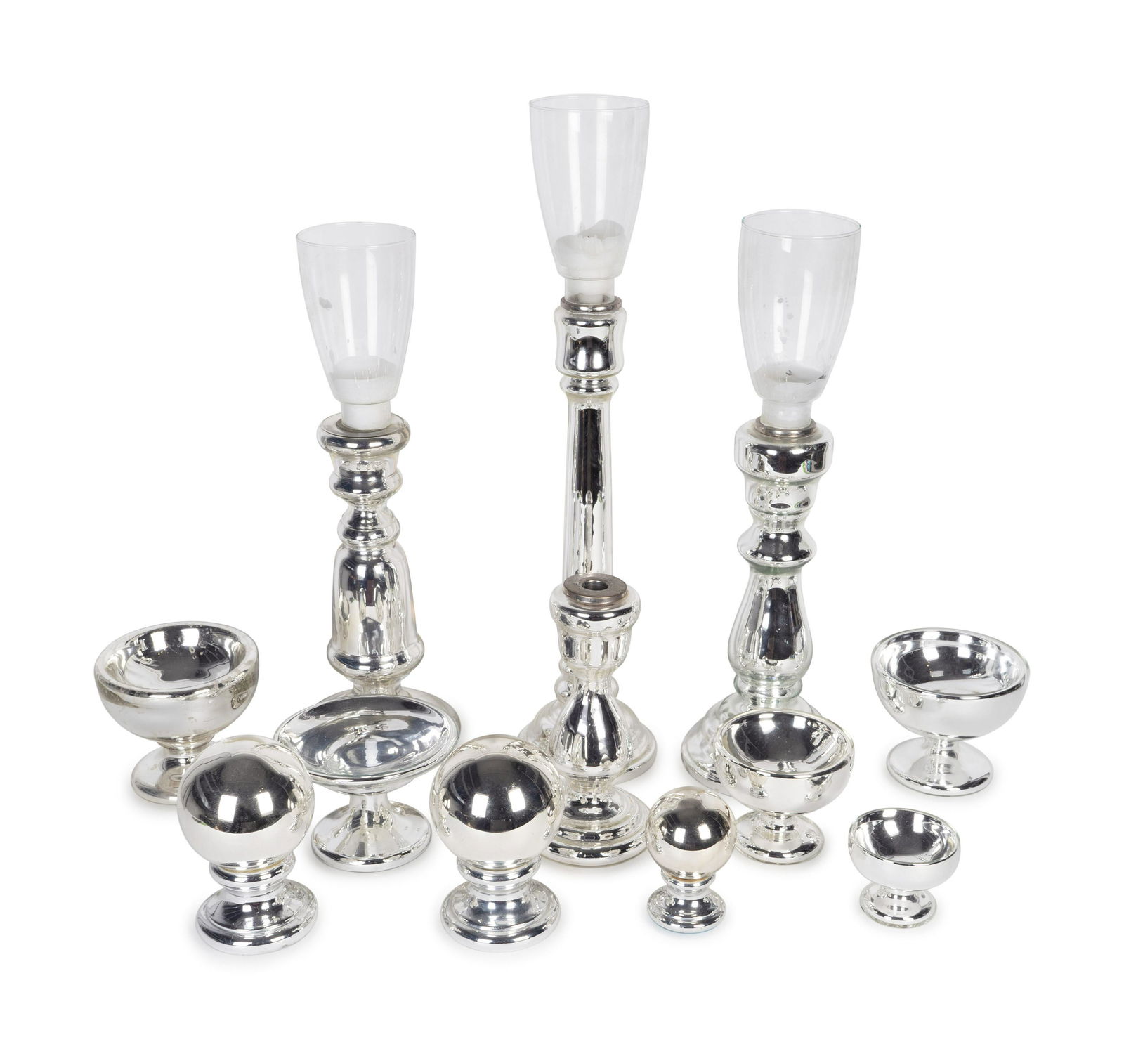 A Large Collection of Mercury Glass Table Articles: A Large Collection of Mercury Glass Table Articles 20TH CENTURY comprising four candlesticks, three gazing balls, and five compotes, along with three glass shades. (15 pieces) Height of tallest 17 inc