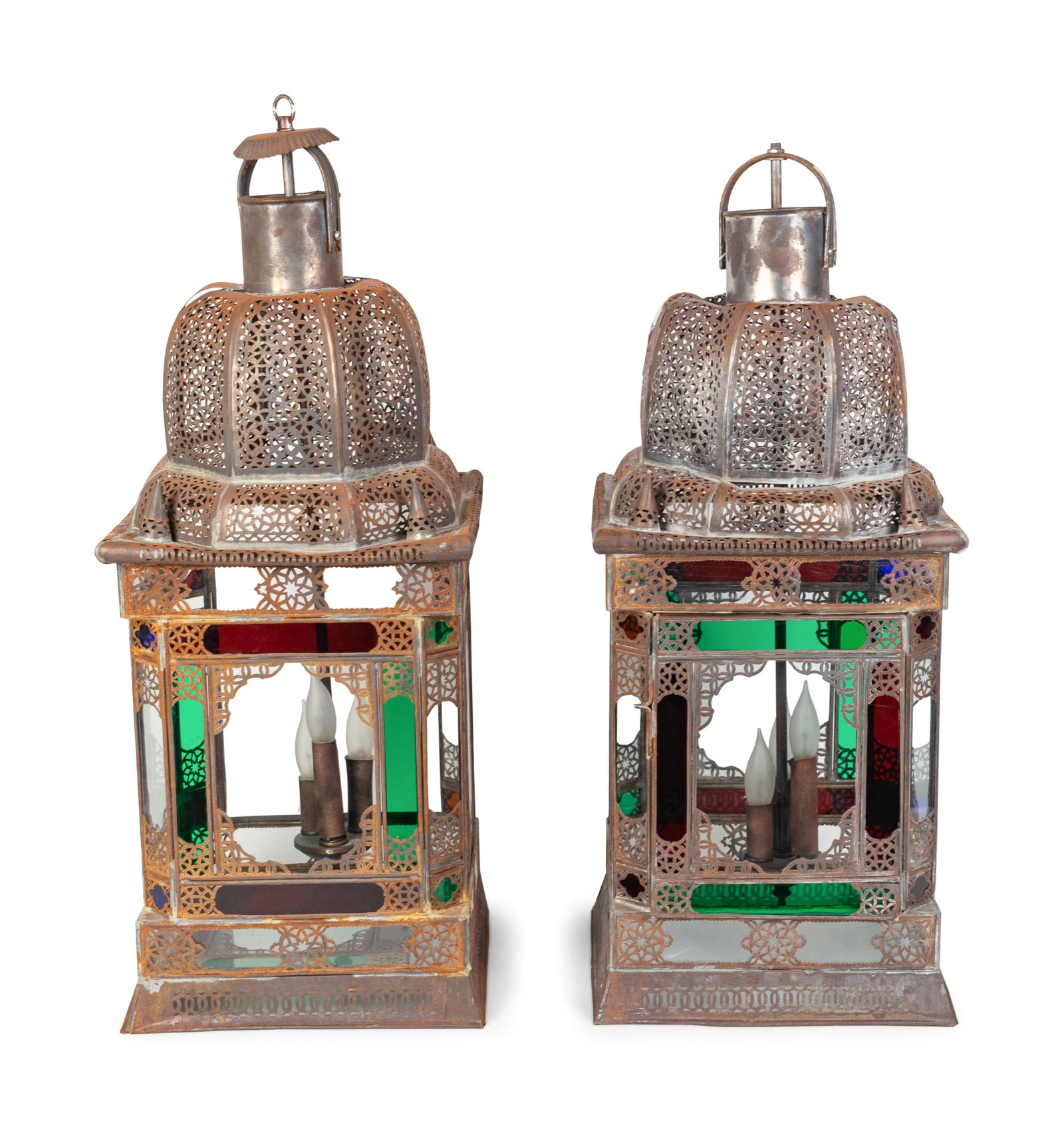 A Pair of Middle Eastern Stamped Metal and Colored: A Pair of Middle Eastern Stamped Metal and Colored Glass Lanterns 20TH CENTURY Height 28 1/2 inches.