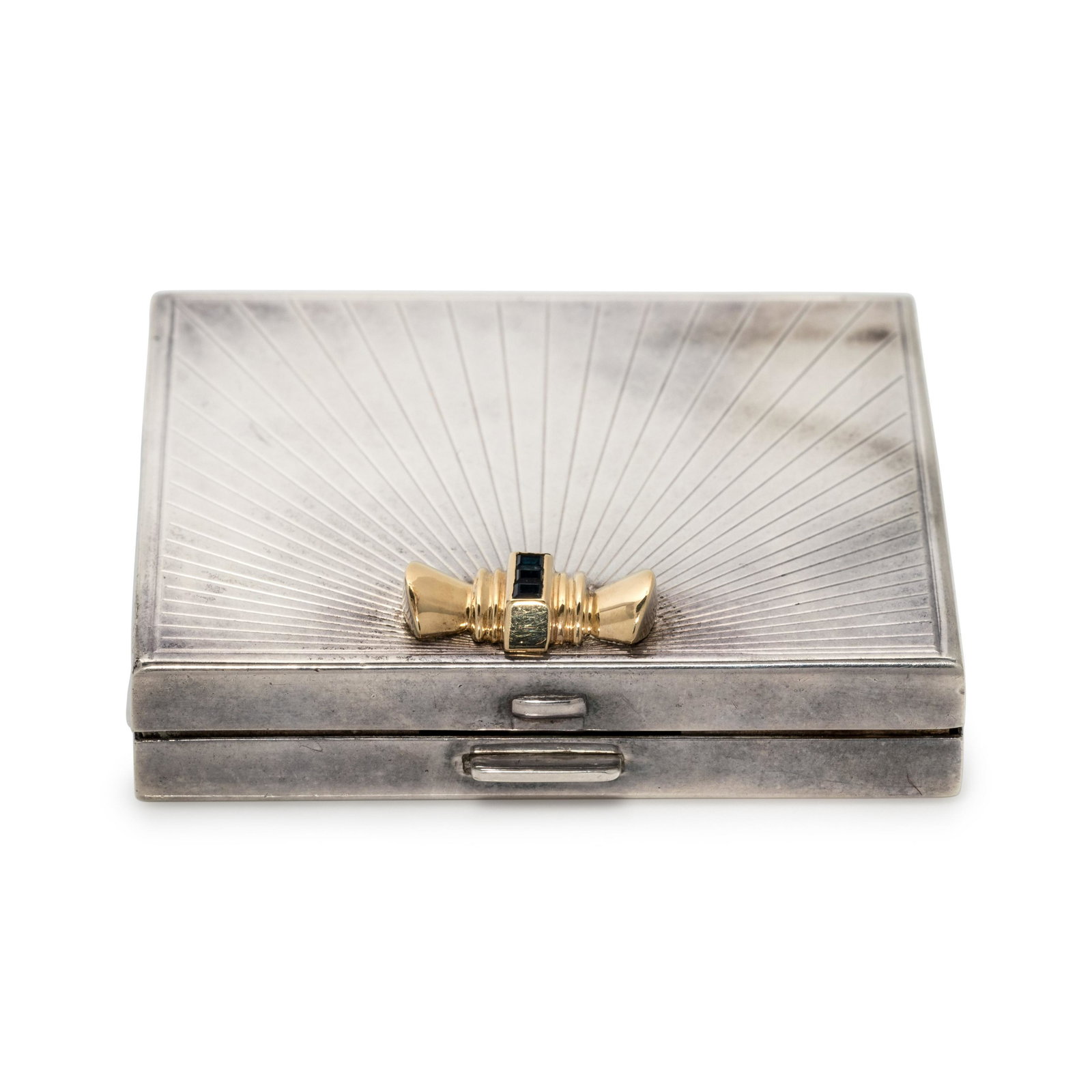 TIFFANY & CO., STERLING SILVER, YELLOW GOLD AND: TIFFANY & CO., STERLING SILVER, YELLOW GOLD AND SAPPHIRE COMPACT Consisting of a sterling silver hinged case with interior mirror and hinged makeup case, the clasp surmounted with a yellow gold plaque