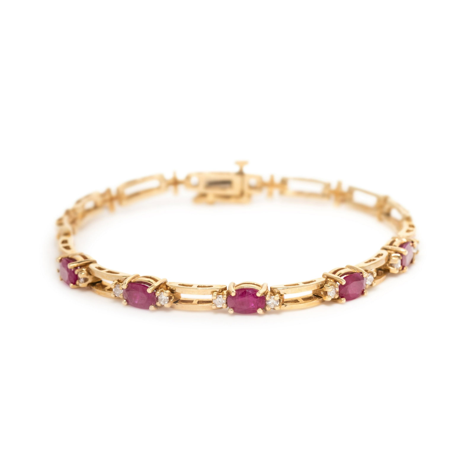 YELLOW GOLD, RUBY AND DIAMOND BRACELET: YELLOW GOLD, RUBY AND DIAMOND BRACELET Containing five oval mixed cut rubies measuring approximately 6.00 x 4.15 mm and 10 round brilliant cut diamonds weighing approximately 0.25 carat total. 7 1/8 i