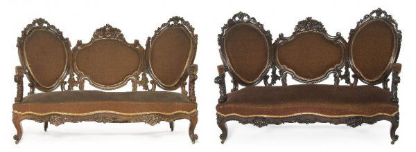 A Pair of Victorian Triple-Back Settees, Width 67 inche: A Pair of Victorian Triple-Back Settees, having upholstered backs, arms and seats within heavily carved foliate frames, raised on cabriole legs with scrolling toes. Width 67 inches.