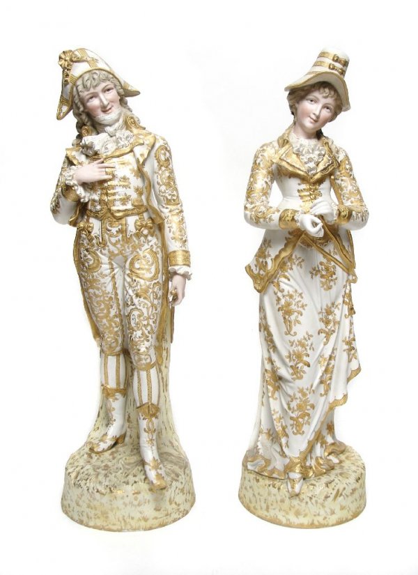 A Pair of Continental Bisque Figures, Height 28 inches.