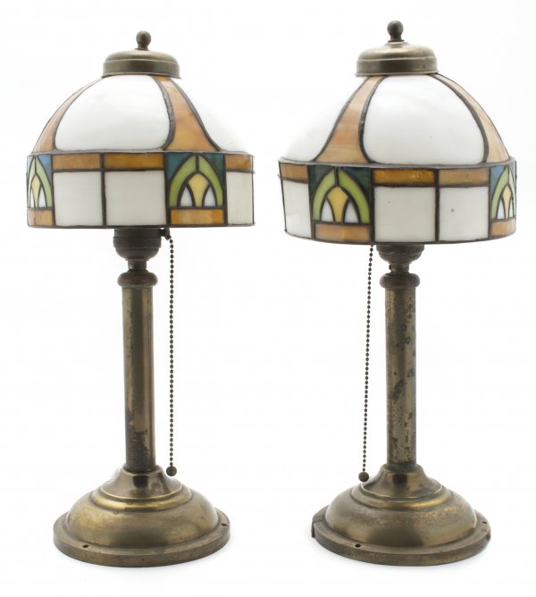 A Pair of American Arts and Crafts Leaded Glass Lamps, : A Pair of American Arts and Crafts Leaded Glass Lamps, each with domed shade having geometric decoration, raised on simple columnar standard over a circular foot. Height 16 inches, diameter 7 1/4 inch