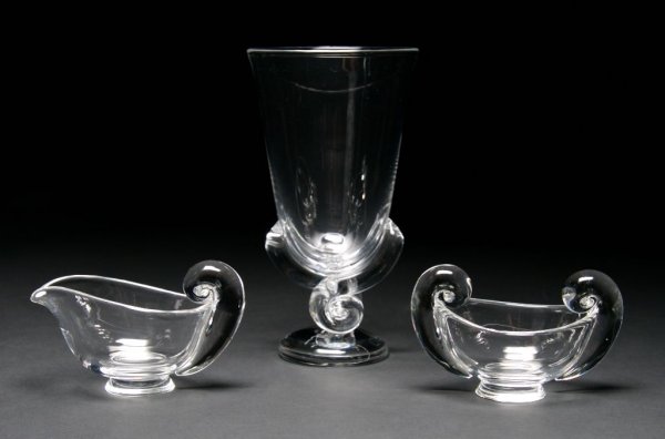 A Steuben Glass Flower Vase, Height of first 8 5/8 inch: A Steuben Glass Flower Vase, model 7913, designed by George Thompson, 1942; together with a creamer and sugar. Height of first 8 5/8 inches.