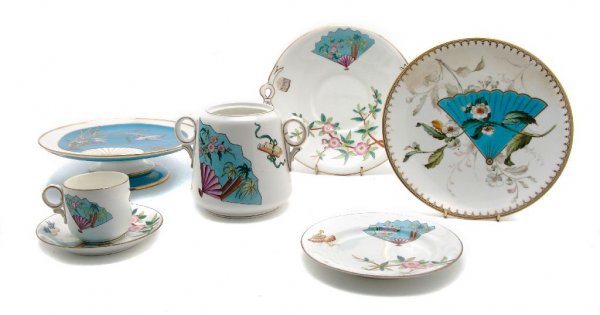An Assembled Collection of English Dinnerware, Diameter: An Assembled Collection of English Dinnerware, in a variety of patterns, each decorated with a Japanese fan, comprising 8 dinner plates, 11 bread plates, 7 cups, 10 saucers, a tazza and 2 circular han