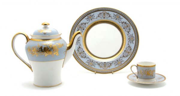 A Partial Set of English Dinnerware, Minton, Diameter o: A Partial Set of English Dinnerware, Minton, comprising six dinner plates, nine cups, nine saucers and a teapot, each with light blue and gilt decorated borders; 25 items total. Diameter of dinner pla