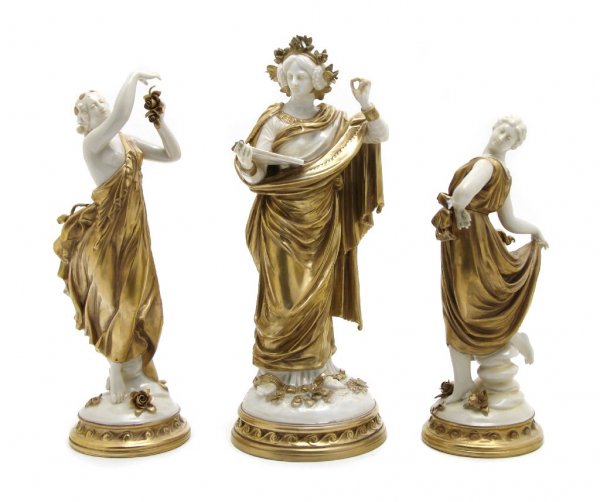 A Group of Three Continental Porcelain Figures, Height : A Group of Three Continental Porcelain Figures, one Capodimonte, each modeled as a classical, robed maiden and having gilt decoration. Height of tallest 11 1/2 inches.