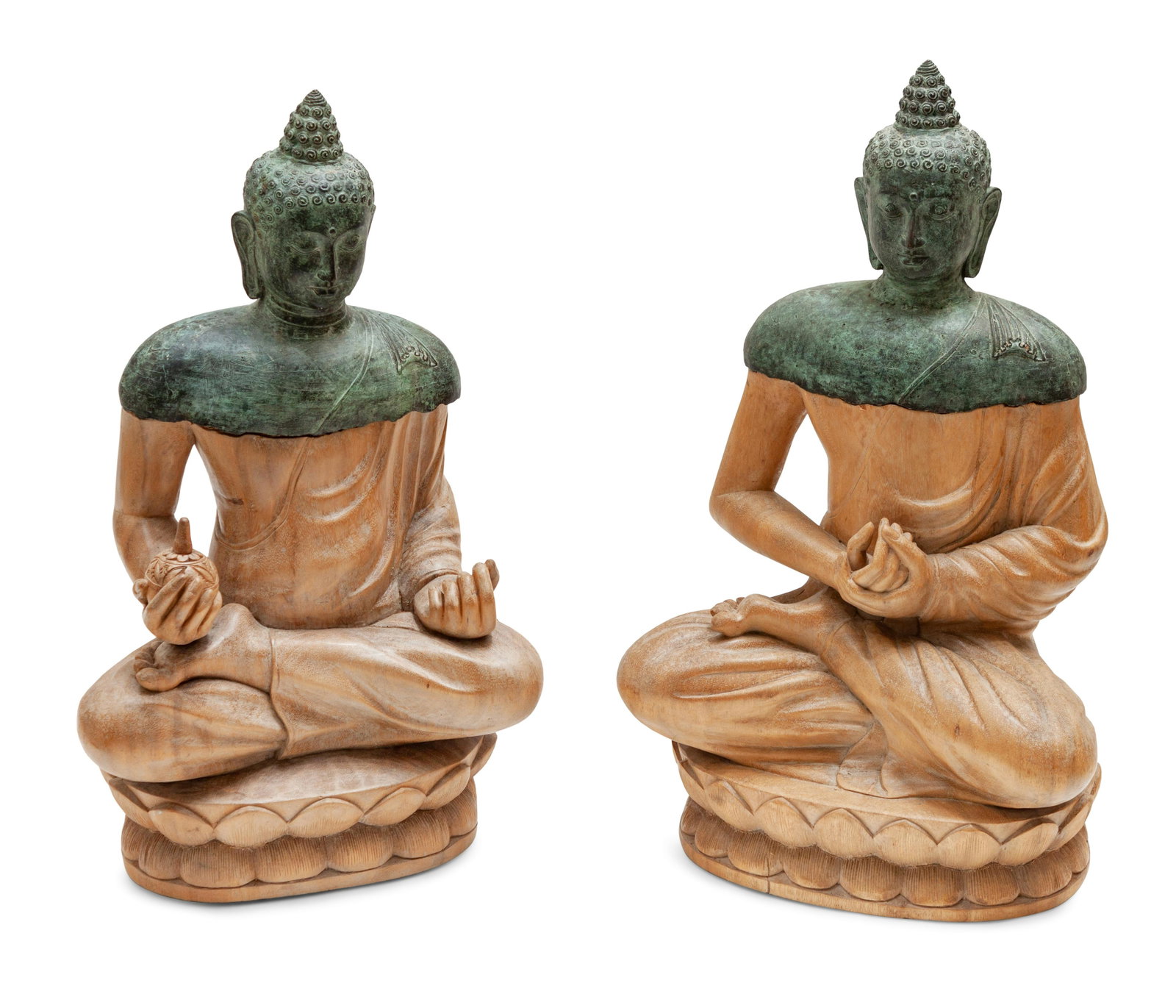 A Pair of Bronze and Carved Wood Seated Buddhas Height: A Pair of Bronze and Carved Wood Seated Buddhas Southeast Asia, 20th century Height 30, width 18 inches. Property from the Collection of Tina and Simon Beriro, Aspen, Colorado