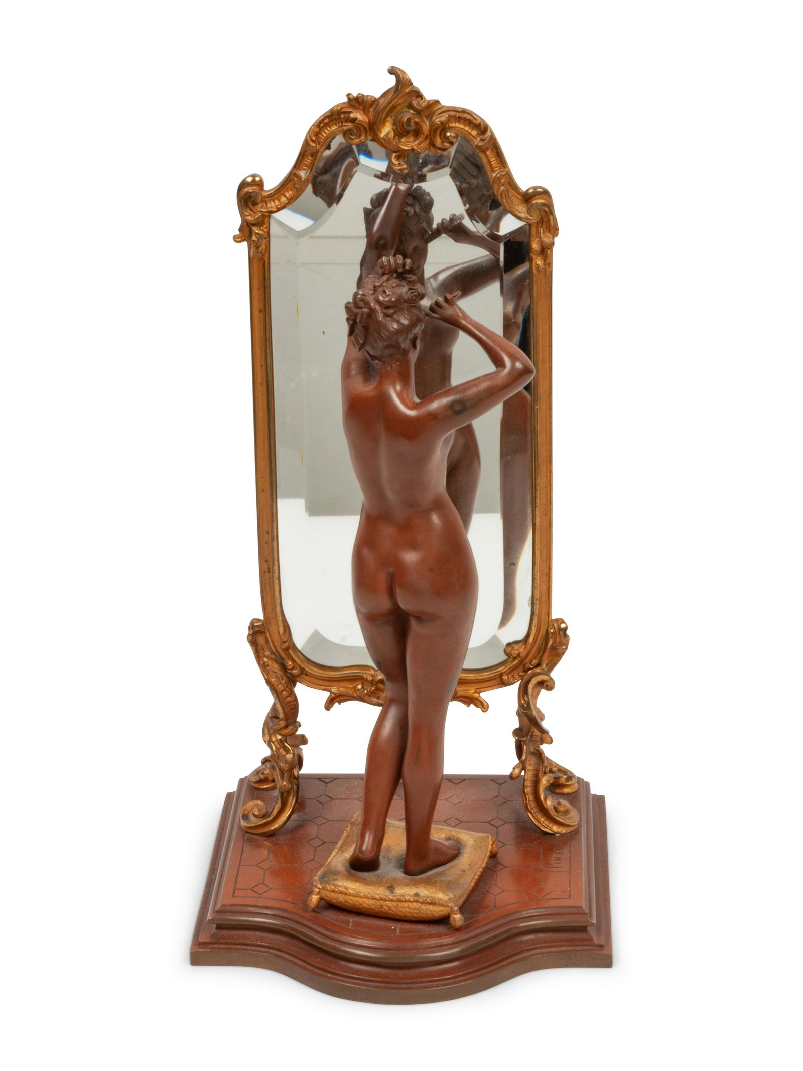 A French Gilt Bronze Nude Figure 14 x 7 x 6 1/2 inches: A French Gilt Bronze Nude Figure (French, 1840-1916) depicting a nude in front of a Rococo style cheval mirror with a beveled plate 14 x 7 x 6 1/2 inches