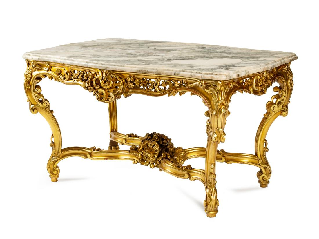 A Louis XV Style Giltwood Marble-Top Table: A Louis XV Style Giltwood Marble-Top Table 19th Century Height 30 x width 53 x depth 35 inches.