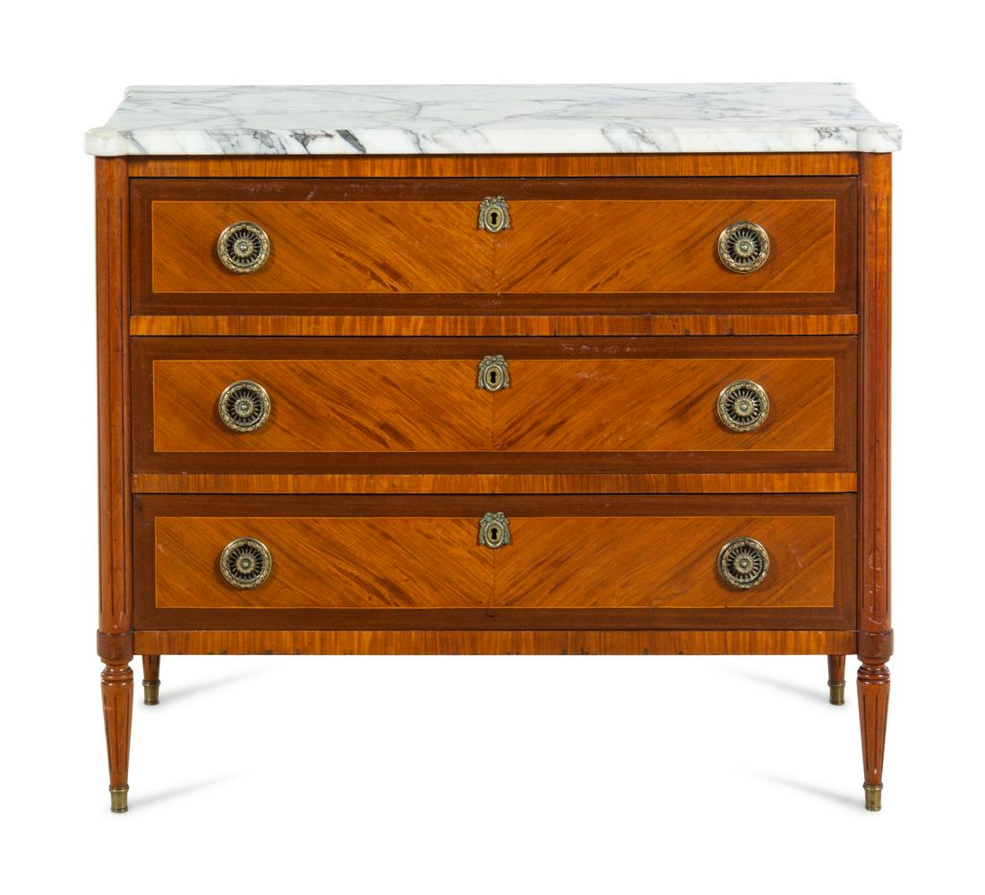 A Louis XVI Style Mahogany and Satinwood Marble-Top: A Louis XVI Style Mahogany and Satinwood Marble-Top Commode 20th Century Height 34 x width 41 x depth 19 inches. Property from the Collection of Steven Huffines, San Francisco, California