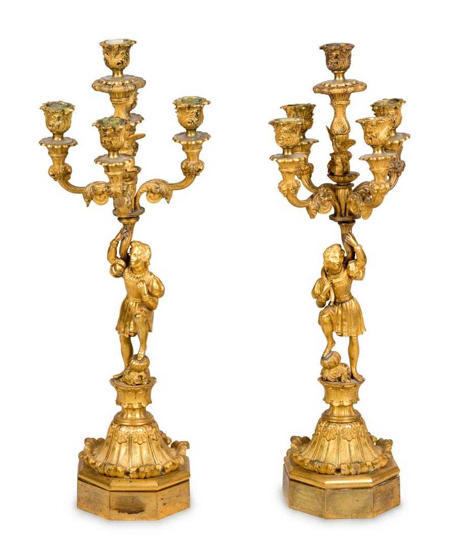 A Pair of Louis Philippe Gilt Bronze Five-Light Figural: A Pair of Louis Philippe Gilt Bronze Five-Light Figural Candelabra 19th Century one example stamped 61428 to the base. Height 21 inches. Property from the Collection of Lance Cameron Fraser, Minneapol