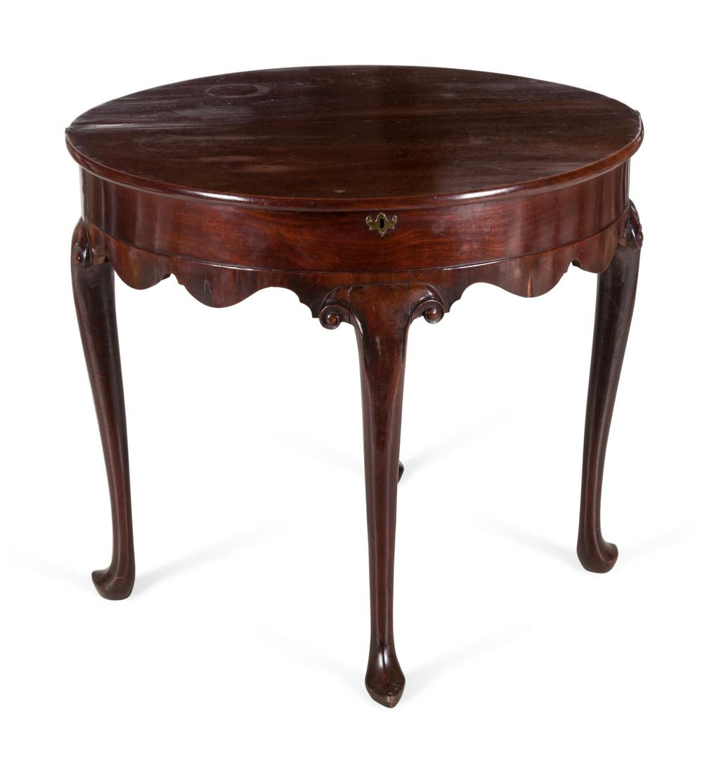 A George II Mahogany Gate-Leg Tea Table: A George II Mahogany Gate-Leg Tea Table Mid-18th Century Height 29 1/2 inches.