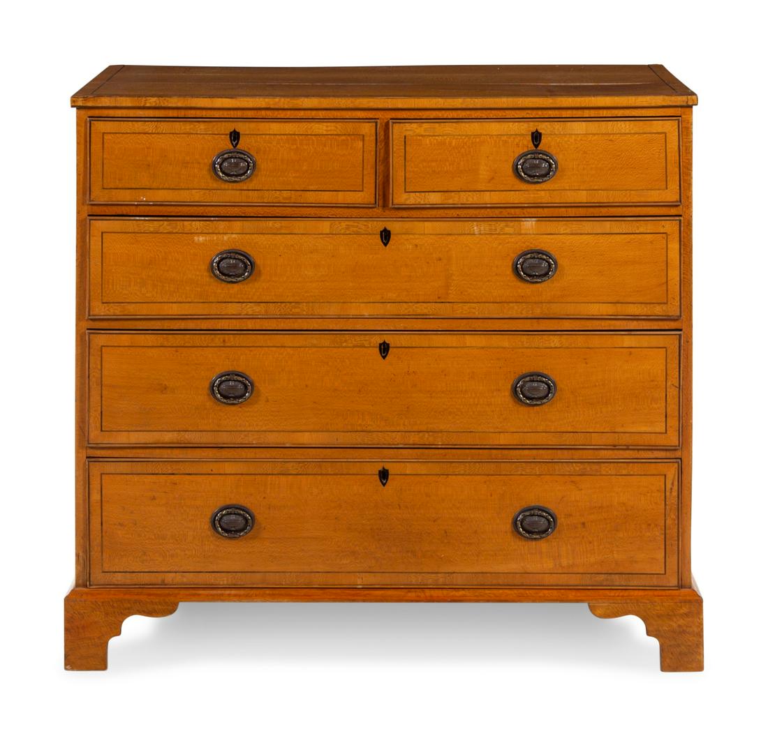 A George III Adam Style Ebony Inlaid Satinwood Chest of: A George III Adam Style Ebony Inlaid Satinwood Chest of Drawers Circa 1860 Height 39 1/4 x width 42 1/2 x depth 22 3/4 inches. Property from the Collection of Mary Southworth, Lake Forest, Illinois