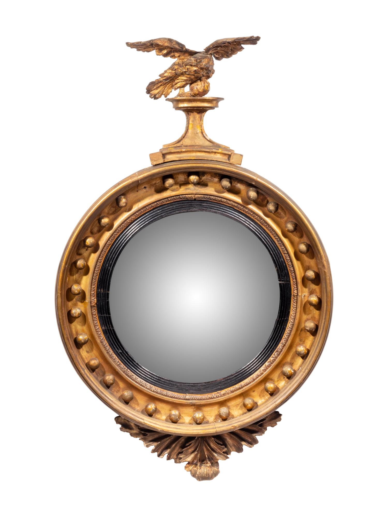 A Regency Giltwood Convex Mirror: A Regency Giltwood Convex Mirror 19th Century Height 37 x width 23 inches. 