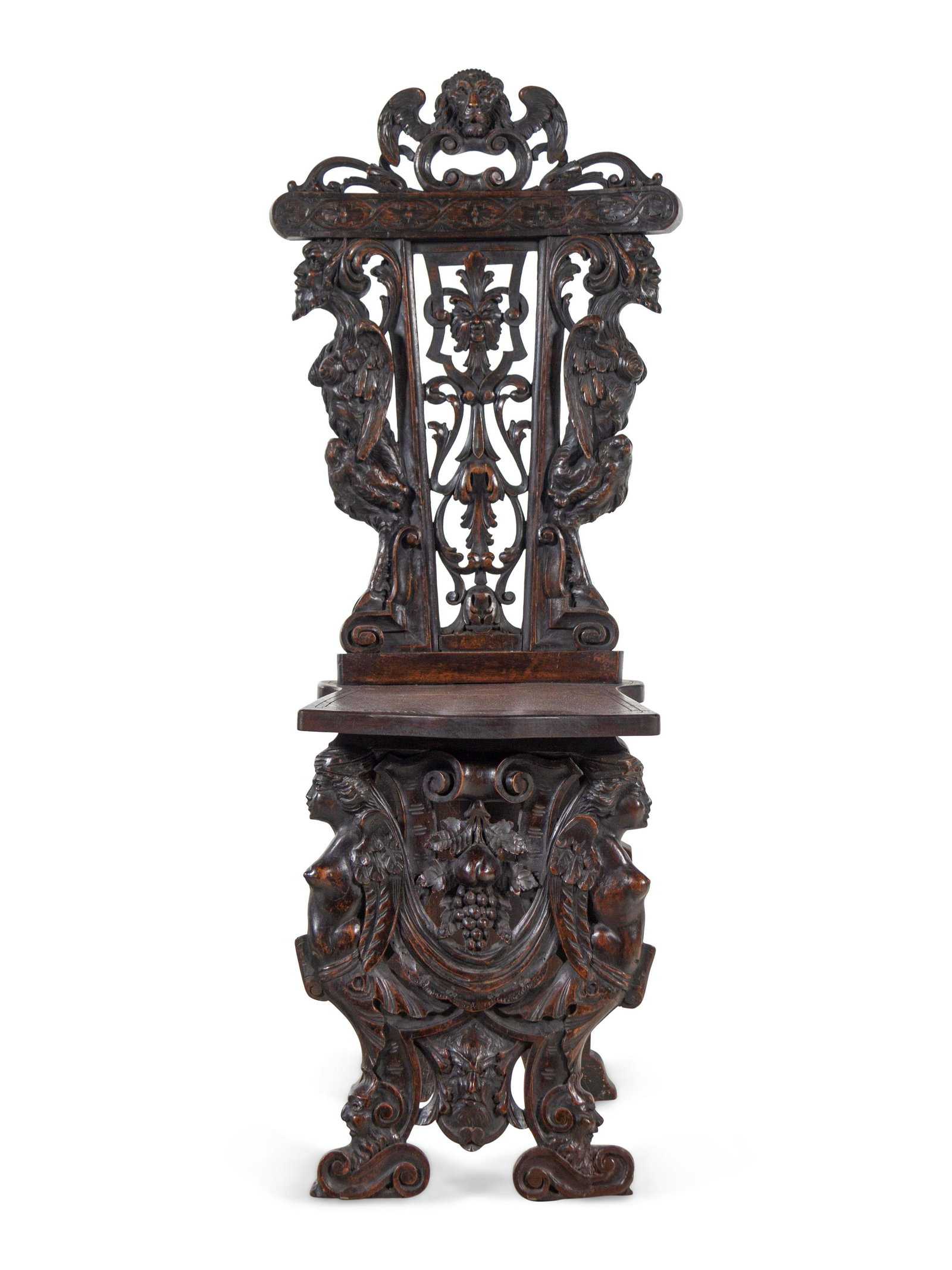 An English Renaissance Revival Carved Mahogany Hall: An English Renaissance Revival Carved Mahogany Hall Chair 19th Century Height 48 1/2 x width 15 1/2 x depth 19 1/2 inches.