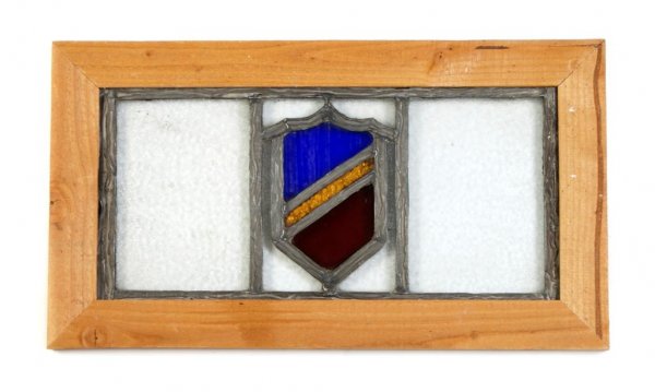 A Leaded Glass Window, Height 8 1/2 x width 18 1/4 inch: A Leaded Glass Window, with shield decoration. Height 8 1/2 x width 18 1/4 inches.