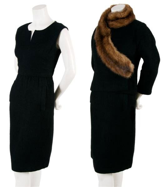 A Christian Dior Black Wool Boucle Dress Suit with: A Christian Dior Black Wool Boucle Dress Suit with Fur Trim, probably 1950s, jacket in a wrap style with three-quarter length sleeves, Poiret inspired asymmetric fur trim at collar, sleeveless dress w