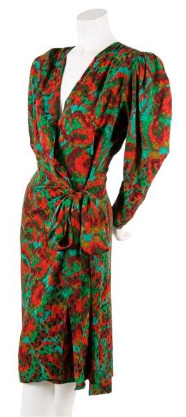 An Yves Saint Laurent Multicolor Silk Print Wrap D: An Yves Saint Laurent Multicolor Silk Print Wrap Dress, 1980s, full length sleeves with zipper closures and puff shoulders, V-neck, sash tie at hips. Labeled: Saint Laurent. Size 40.