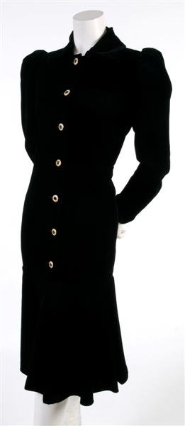 An Yves Saint Laurent Black Velvet Dress, Size 42.: An Yves Saint Laurent Black Velvet Dress, 1980s, with rhinestone buttons leading into a drop waist, fully lined. Labeled: Saint Laurent. Size 42.