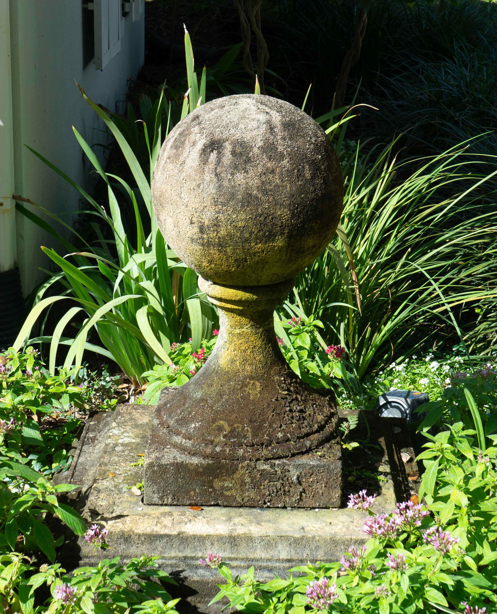 A Pair of Carved Stone Sphere Form Capitals on Pyramid (1 of 2)