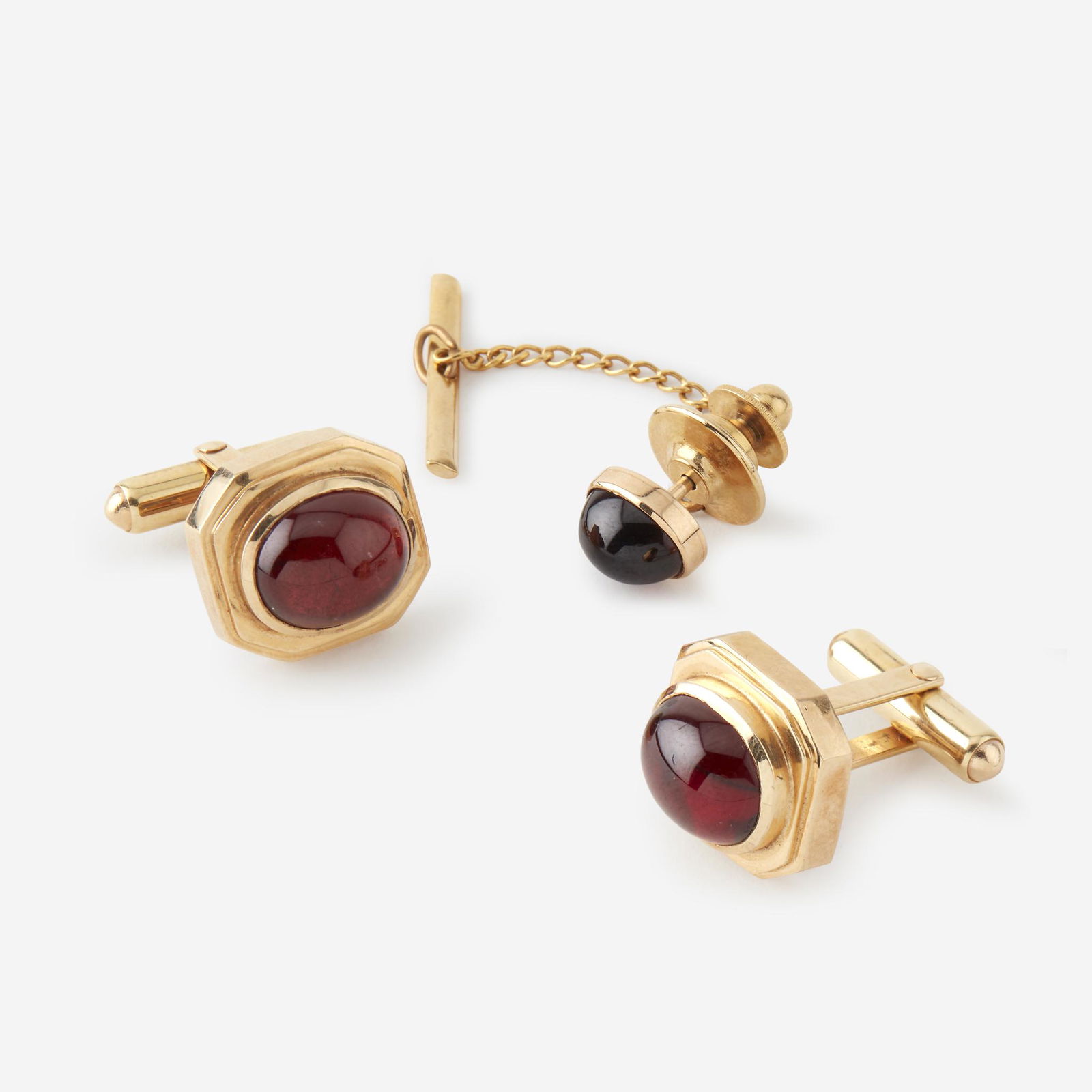 A pair of garnet and fourteen karat gold cufflinks with (1 of 1)