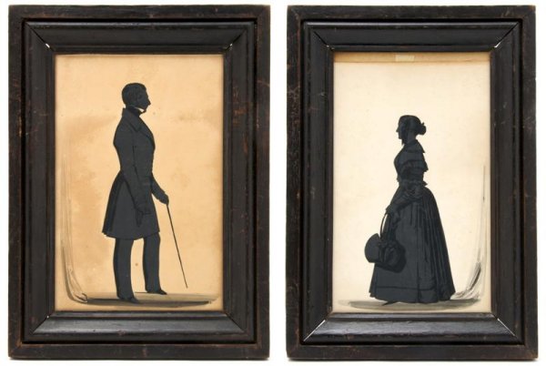 A Pair of Full Length Silhouettes, Herve, Height o: A Pair of Full Length Silhouettes, Herve, depicting a gentleman holding a walking stick, the second of a lady with bonnet at her side, set in ogee frames. Height of each 10 1/4 x width 6 3/4 inches. P