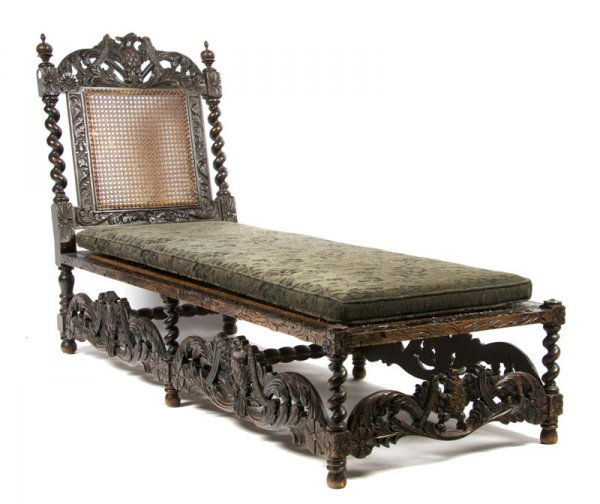 A Renaissance Revival Chaise Lounge, Height 41 1/2: A Renaissance Revival Chaise Lounge, having carved eagle sides with carved foliate decoration throughout, supported by twist legs joined by stretchers, bottom rails depicting eagles surrounding the ba
