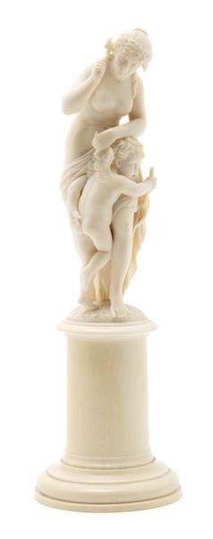 A French Carved Ivory Figural Group, Height 9 7/8: A French Carved Ivory Figural Group, depicting Venus punishing Cupid, raised on a circular plinth base. Height 9 7/8 inches.