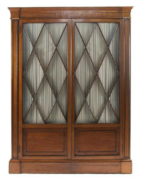 A Continental Satinwood and Ebony Bookcase Cabinet: A Continental Satinwood and Ebony Bookcase Cabinet, having inlaid ebony stringing throughout with stepped cornice and two glazed doors, raised on plinth form base. Height 84 x width 62 1/2 x depth 18